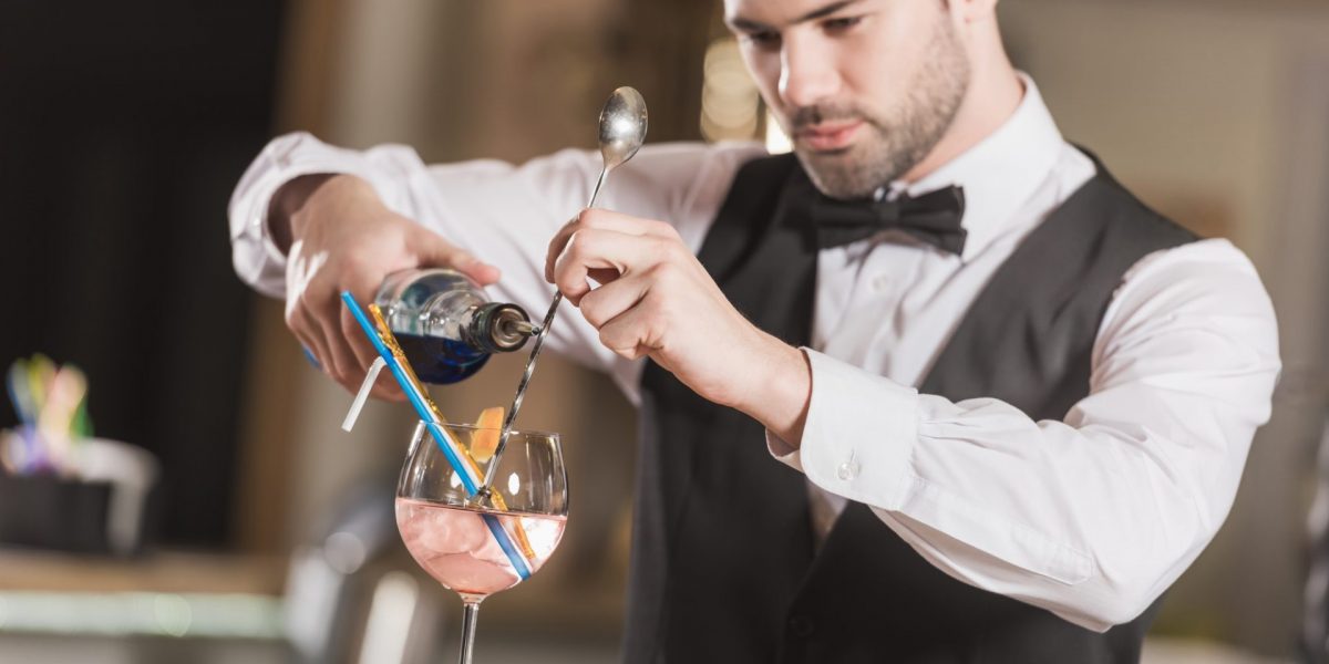 barman-making-alcohol-cocktail-at-bar-counter.jpg